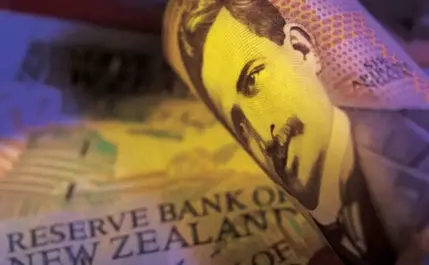 NZ dollar holds steady against greenback amid positive confidence surveys